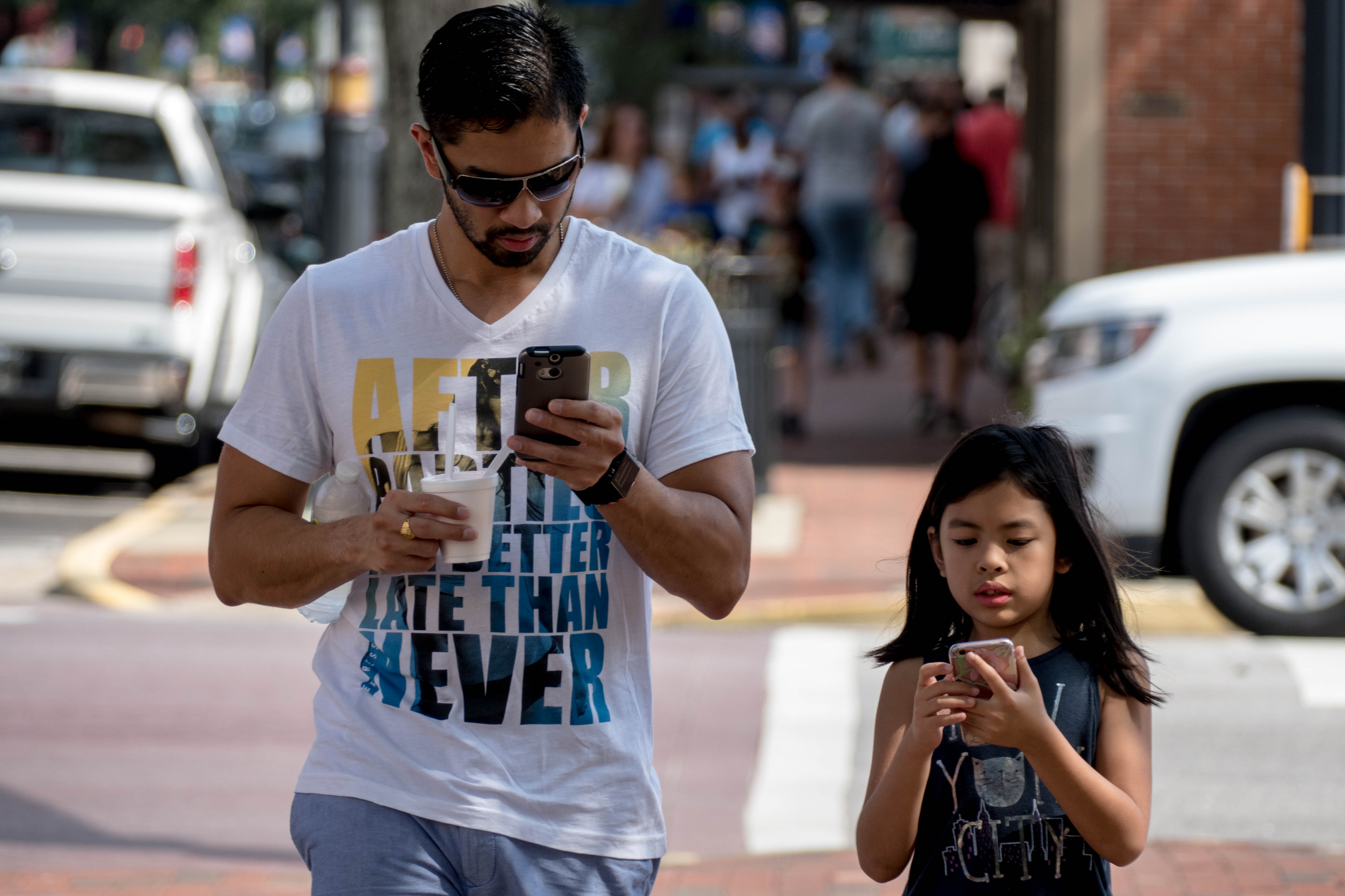 Children and adults taking part in Pokemon Go