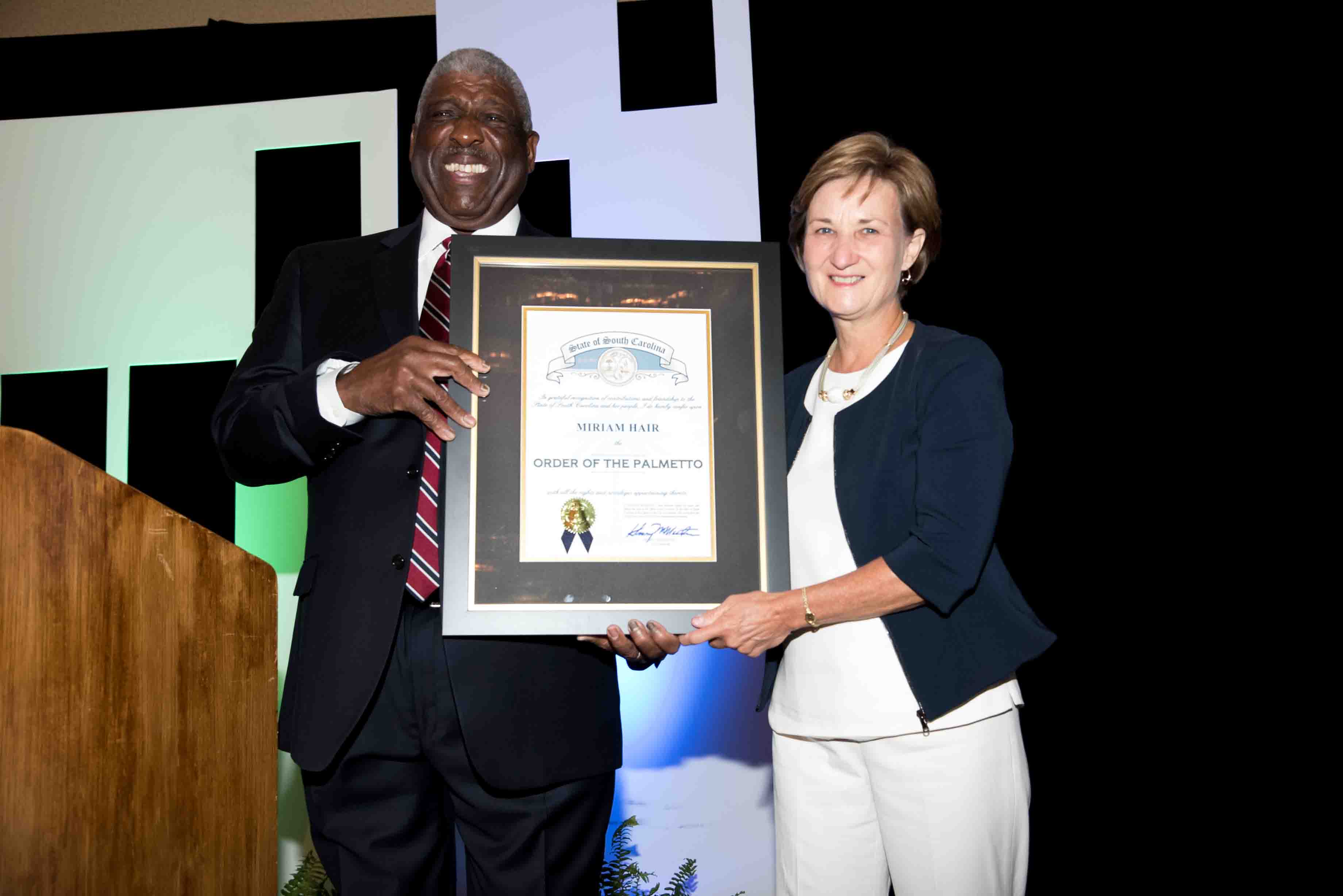 Sen. Floyd Nicholson (D-Greenwood) surprised Miriam Hair with the Order of the Palmetto 