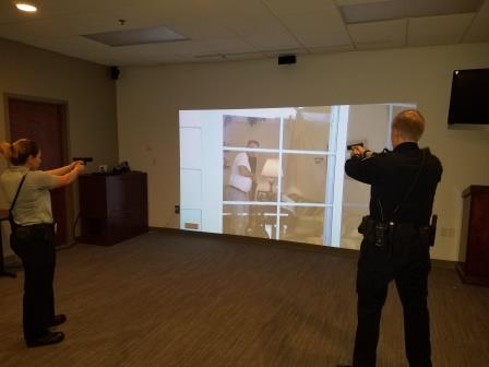 Police officers using simulator