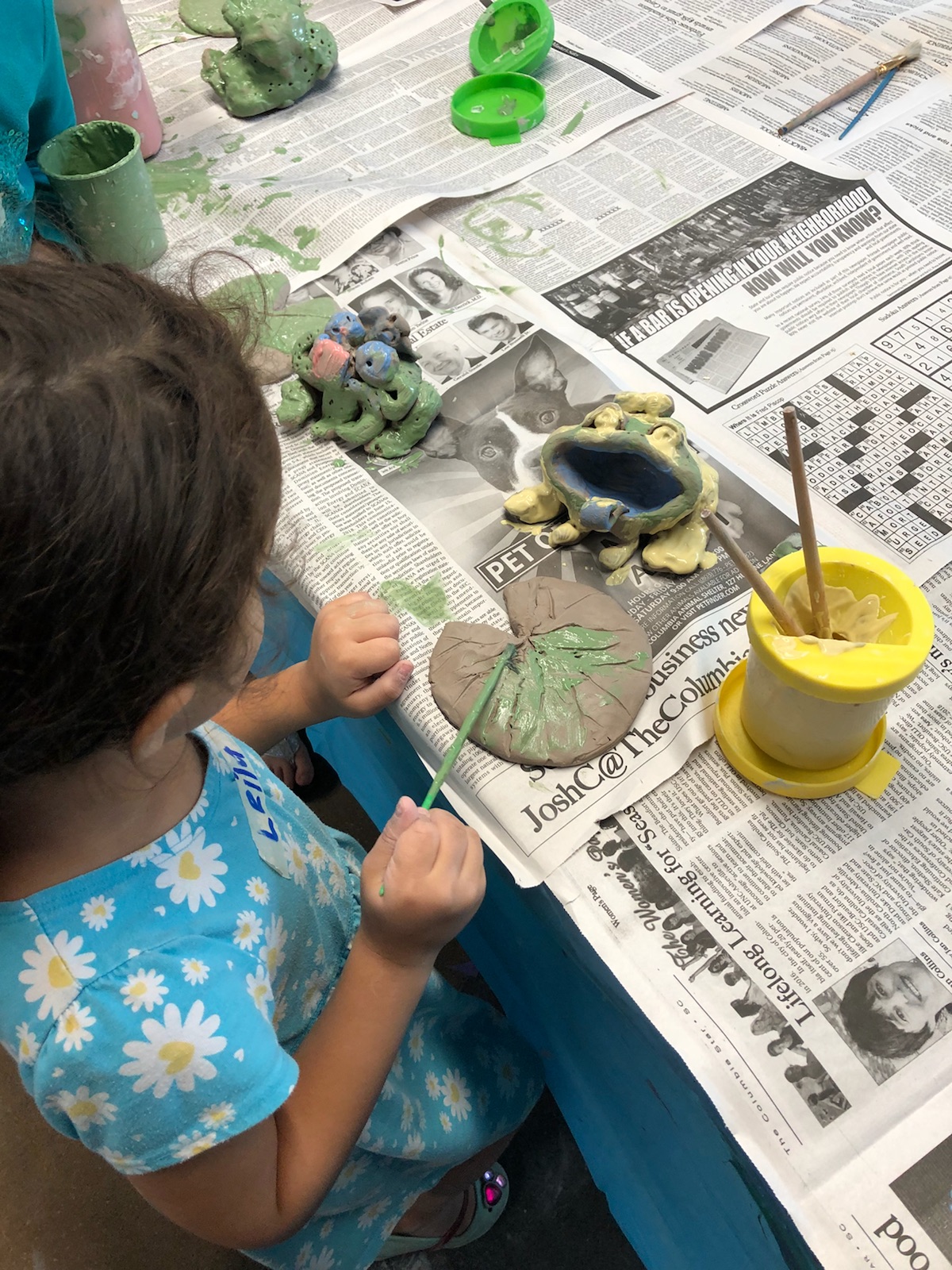 Child painting at City of Columbia arts center