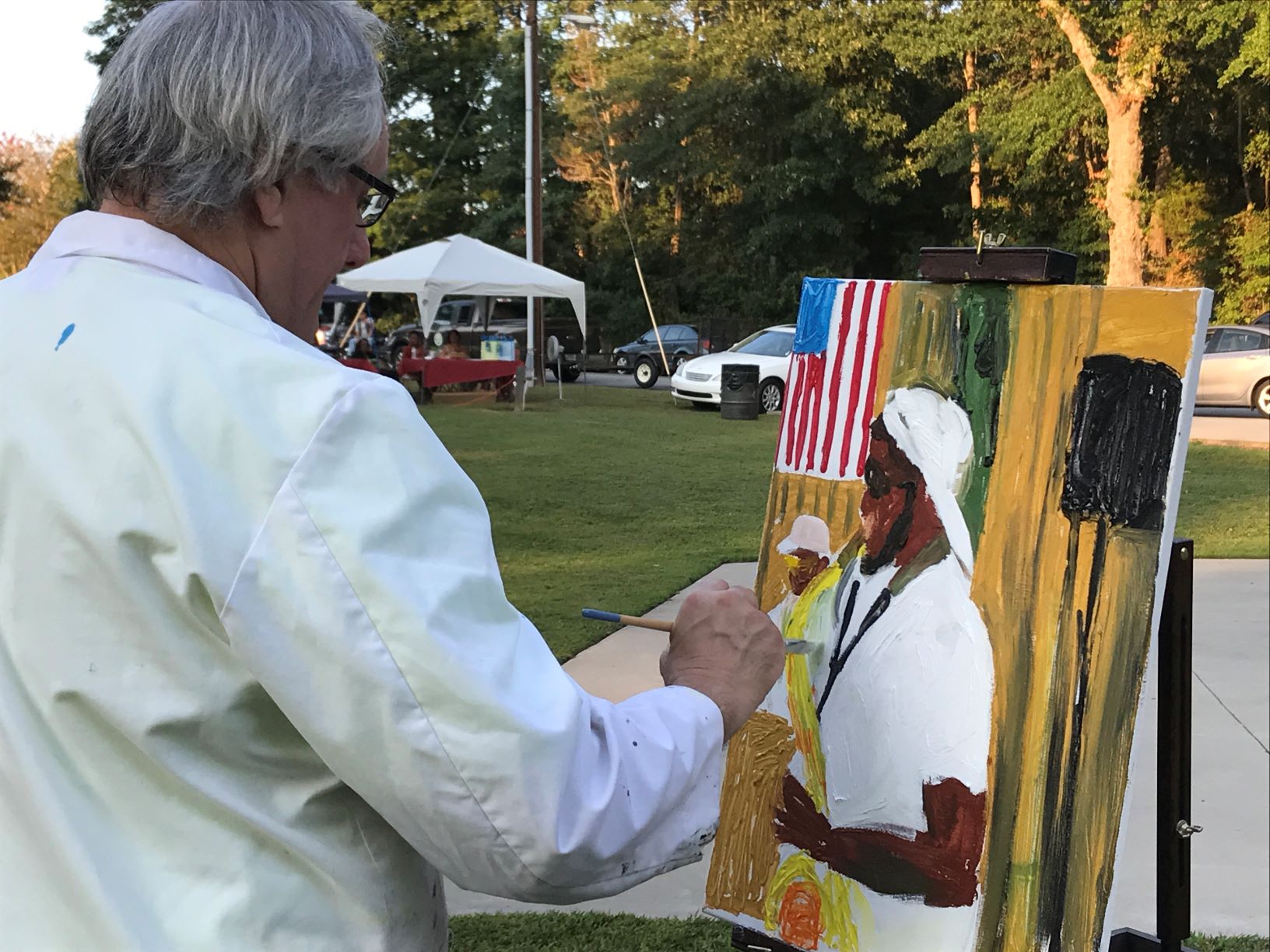 Artist Carter Boucher painting scenes of Williamston's Fall Jazz Concert Series