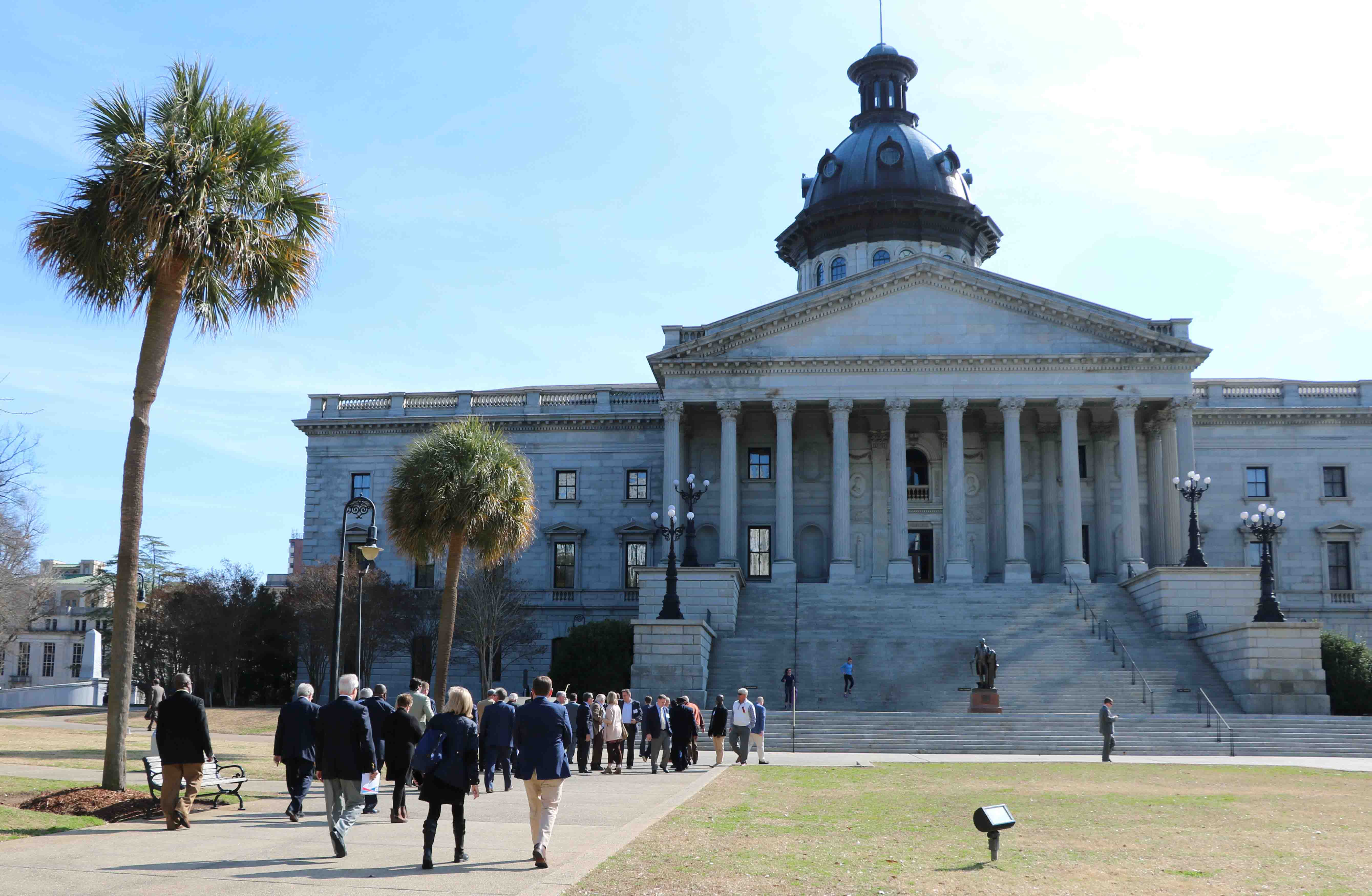 Municipal officials visit their legislators at the State House