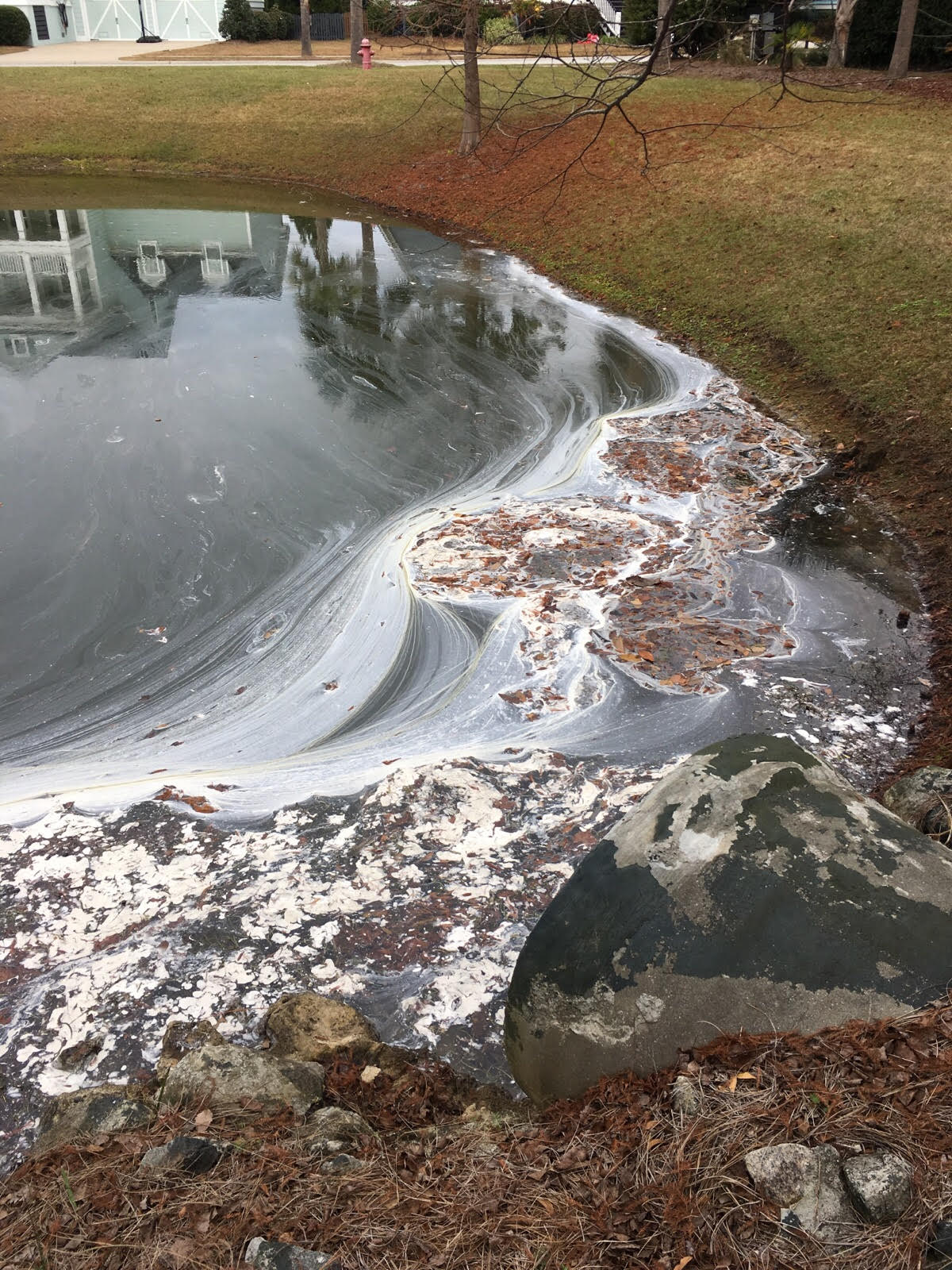 Town of Mount Pleasant's Spill Response Team responds to an incident in which paint was dumped in a pond