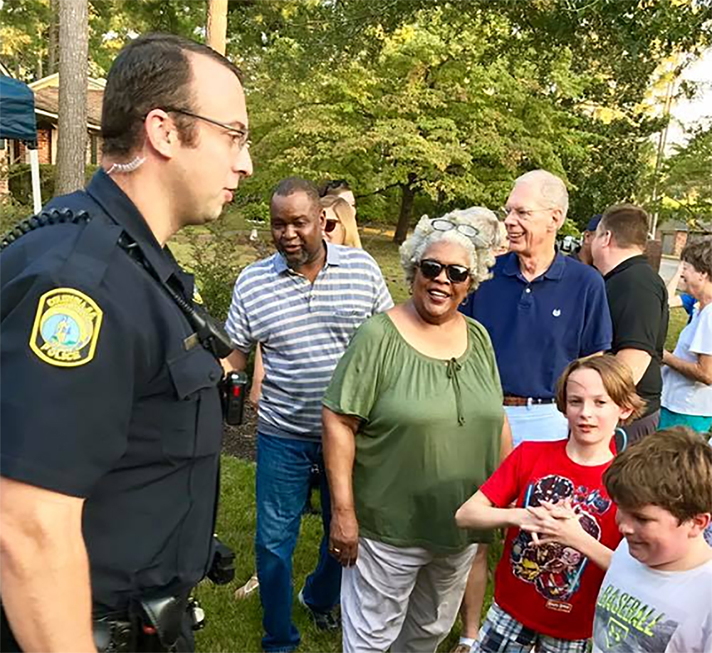 Columbia police officer speaking to residents