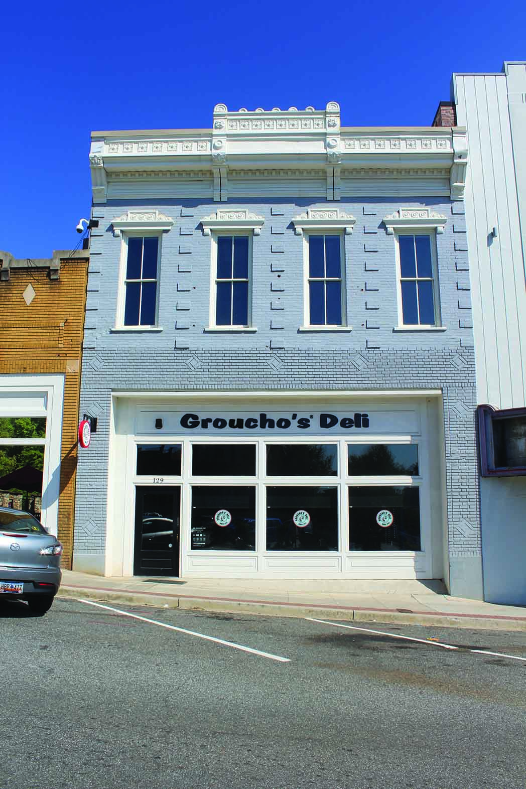 First built in about 1910, the Tolly Furniture building now houses a Groucho’s Deli.