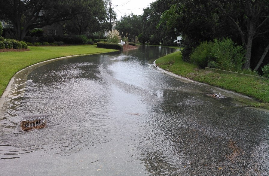 Mount Pleasant street  with water flowing freely through storm drains